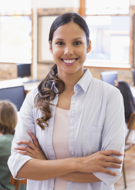 Young female teacher in classroom